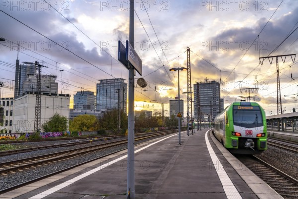 Regional train arriving at Essen central station, platform, city centre skyline, North Rhine-Westphalia, Germany, Europe