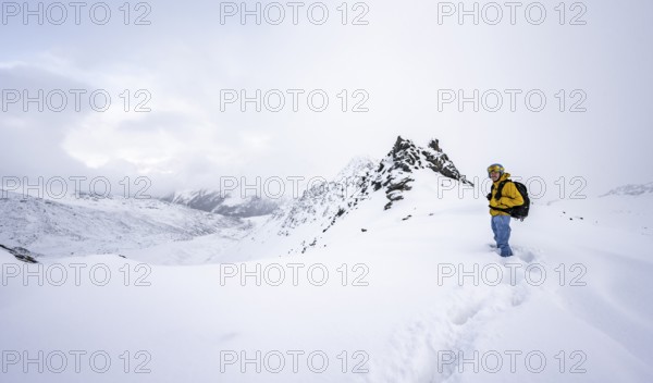 Ski tourers in a wintry mountain landscape in fresh snow, Ortler Alps, Vinschgau Valley, Italy, Europe