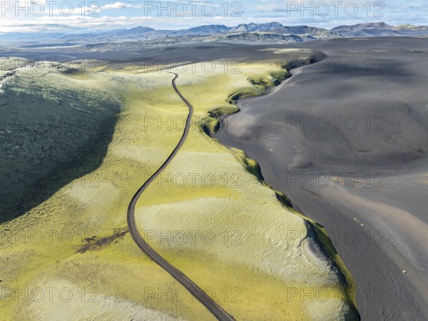 Mountain road F206 along moss-covered Laki crater or Lakagígar, series of craters, aerial view, interior highlands of Iceland, Suðurland, Iceland, Europe