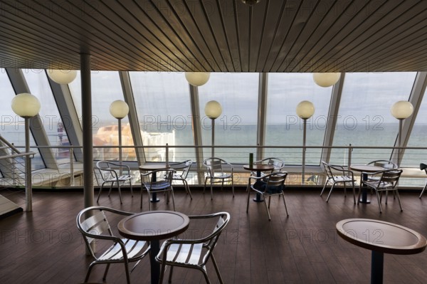 Empty tables and chairs, deck of a ferry to Wales with a view of the sea, interior shot, Rosslare, Wexford, Ireland, Europe