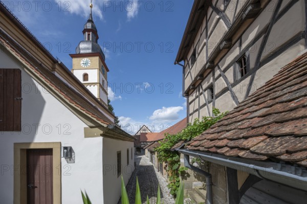Inner courtyard with wine cellars and St John's Church in the historic fortified church, Hüttenheim, Lower Franconia, Bavaria, Germany, Europe