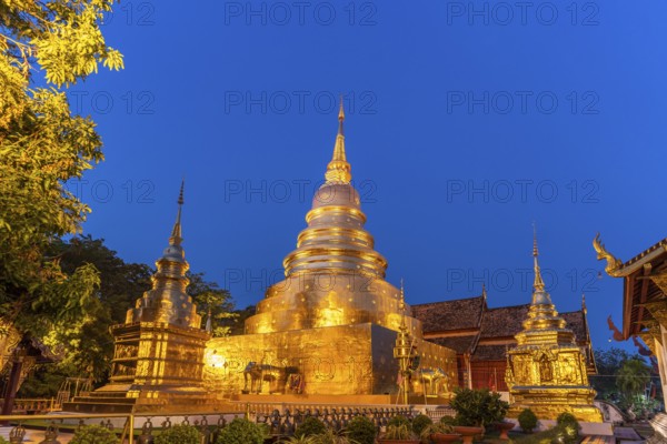 Golden Chedi Phrathatluang of the Buddhist temple complex Wat Phra Singh at dusk, Chiang Mai, Thailand, Asia