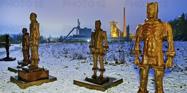 People made of iron, multi-part iron sculpture by Zbigniew Fraczkiewicz in front of the Henrichshütte in winter, Hattingen, Ruhr area, Germany, Europe