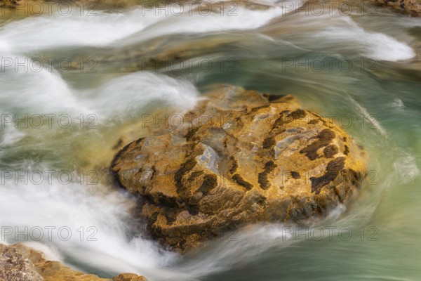 The Riss creek flowing through an autumnal landscape in the Eng valley