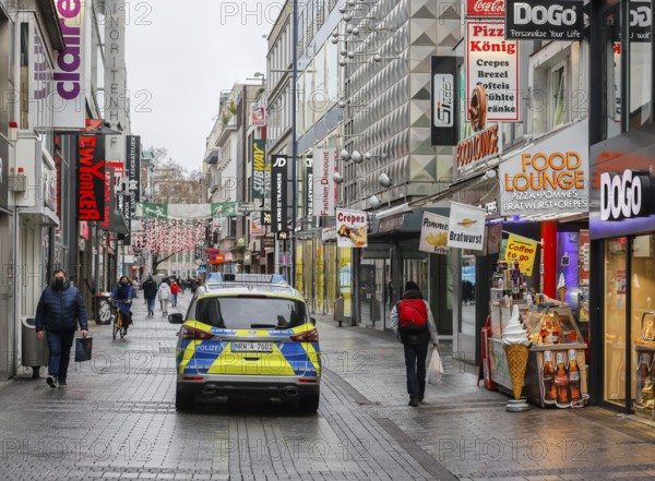 Cologne, North Rhine-Westphalia, Germany - Cologne city centre in times of the corona crisis during the second lockdown, the shops are closed, only a few passers-by are walking on Hohe Straße on Friday afternoon, police are on patrol