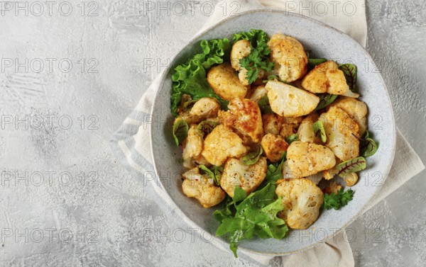 Fried cauliflower salad, with spices and herbs, homemade, no people