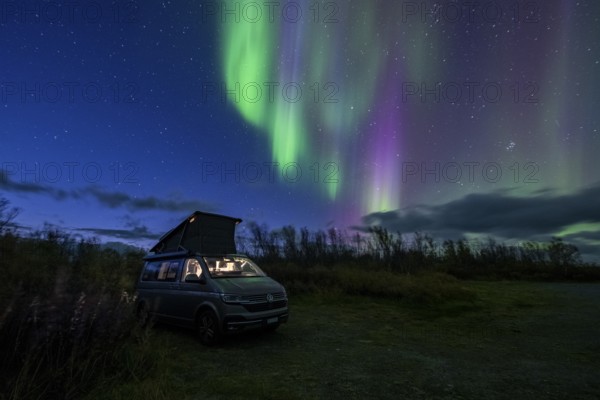 Northern lights over camper, VW California, Lyngen, Troms og Finnmark, Norway, Europe