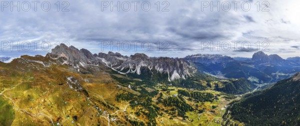 Dark clouds over the Geisler and Puez Group, wide-angle panoramic shot, drone shot, Val Gardena, Dolomites, Autonomous Province of Bolzano, South Tyrol, Italy, Europe