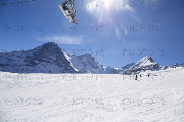 25 March 2024: Skiing against the backdrop of the north face of the Eiger in Grindelwald, Switzerland, Europe