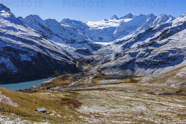 Alpine meadows covered in light snow, with the Moiry glacier in the background, near Grimentz, Val d'Anniviers, Valais Alps, Canton Valais, Switzerland, Europe