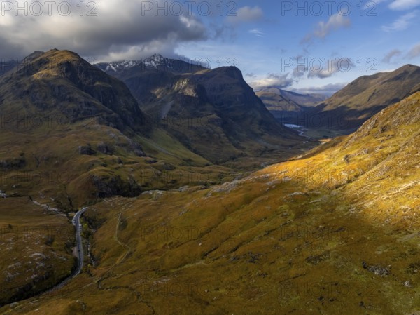 Cloudy mood, morning light, road, valley, mountains, aerial view, autumn, Glencoe, Three Sisters, Scottish Highlands, Scotland, Great Britain