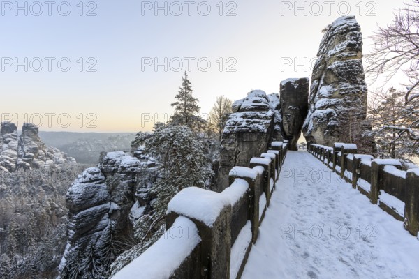 Snow on the Bastei bridge, rock gate and rock castle Neurathen in the morning, Saxon Switzerland, Saxony, Germany, Europe