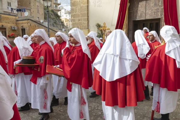 Confraternity of penitents gathering outside San Leonardo church, Enna, Siclly, Italy, Europe