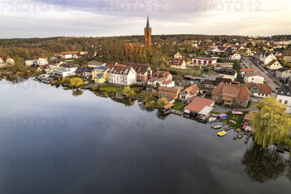 The town of Feldberg on Feldberger Haussee with the town church seen from the air, Feldberger Seenlandschaft, Mecklenburg-Vorpommern, Germany, Europe