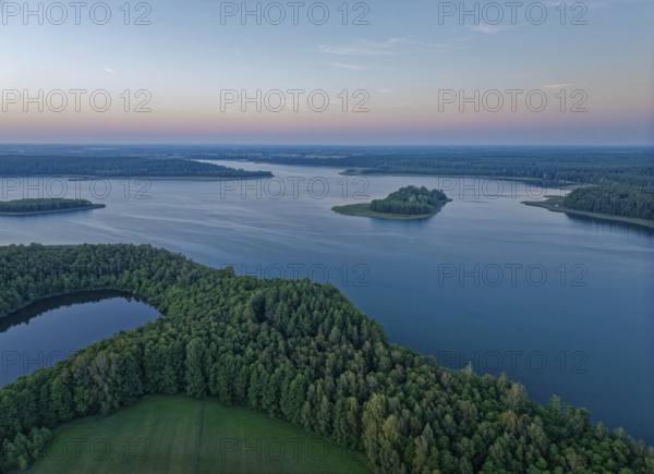 Aerial view of Lake Wigry and the landscape in the Wigry National Park in northern Poland in the evening light. Krusznik, Podlaskie, Poland, Europe