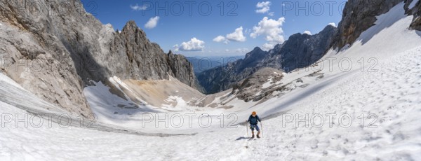 Panorama, mountaineer on a snowfield, mountain basin with glacier remnant of the Höllentalferner, Höllental, rocky mountain peaks, Höllental, Bavaria, Germany, Europe