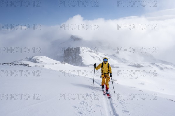 Ski tourers in a snowy mountain landscape, ascent to the Wildhorn, cloudy mood, high tour, Bernese Alps, Bernese Oberland, Switzerland, Europe