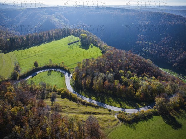 Country road near Lenningen with winding road, landscape on the Swabian Alb in autumn. Aerial view of the Gutenberg Steige near Lenningen, Baden-Württemberg, Germany, Europe