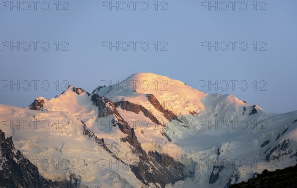 Glaciated mountain peak of Mont Blanc at sunset, alpenglow, Mont Blanc massif, Chamonix, France, Europe