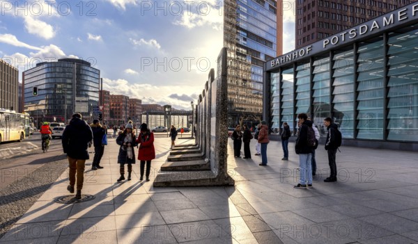 Tourists in front of the Wall segment at Potsdamer Platz, Berlin, Germany, Europe