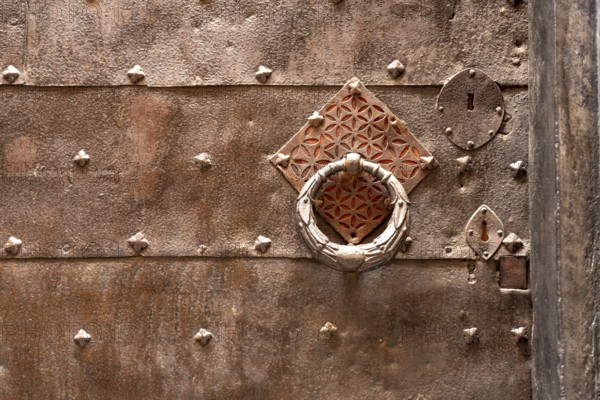 Metal door knocker, in Finalborgo, Finale Ligure, Riviera di Ponente, Liguria, Italy, Europe