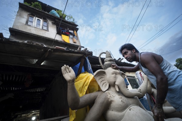 Guwahati, India. 4 September 2024. Artisan work on idols of the elephant-headed Hindu deity Ganesha at a workshop ahead of the Ganesh Chaturthi festival, in Guwahati