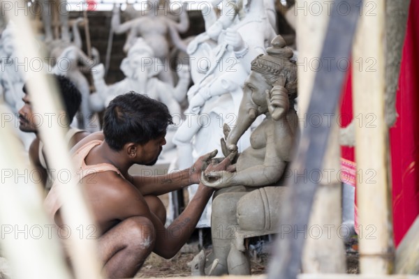 Artisan work on idols of the elephant-headed Hindu deity Ganesha at a workshop ahead of the Ganesh Chaturthi festival, in Guwahati, Assam, India on 3 September 2024