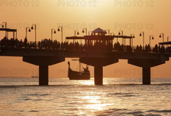 Sunset at the pier in Miedzyzdroje, Western Pomerania, Poland, East Europe, Europe