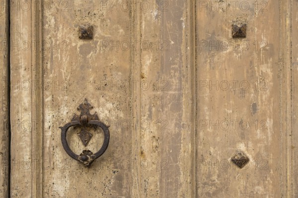 Door knocker on an old wooden gate, Galatina, Apulia, Italy, Europe