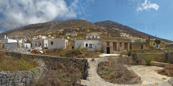 The traditional and idyllic mountain village of Avlona with stone houses and dry vegetation, Avlona, Diafani, Karpathos, Greece, Europe