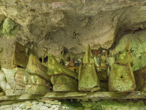 Ancient burial sites, old wooden coffins and carved dolls, rock tombs, Tau Tau Lemo, Rantepao, Tana Toraja, Sulawesi, Indonesia, Asia