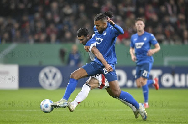 One-on-one, action Kevin Akpoguma TSG 1899 Hoffenheim (25) against Mahir Emreli 1. FC Nürnberg FCN (30) DFB-Pokal, PreZero Arena, Sinsheim, Baden-Württemberg, Germany, Europe