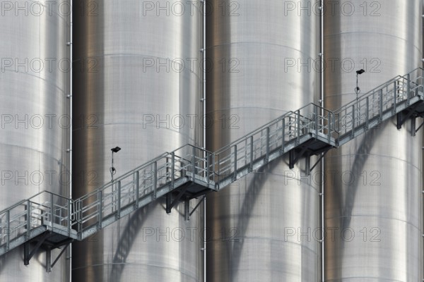 High silo facility for bulk goods, aluminium silo with external staircase, Parallelhafen, Duisburg-Neuenkamp, North Rhine-Westphalia, Germany, Europe
