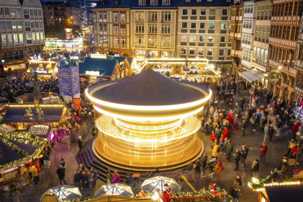 The carousel on the Römerberg turns. The Frankfurt Christmas Market was officially opened on 25 November 2024 when the lights on the Florian Christmas tree, a 26-metre-high spruce from Lower Franconia, were switched on. The Christmas market will be open until 22 December from Monday to Saturday from 10:00 am to 9:00 pm and on Sundays from 11:00 am to 9:00 pm. Frankfurt am Main, Römerberg, Hesse, Germany, Europe