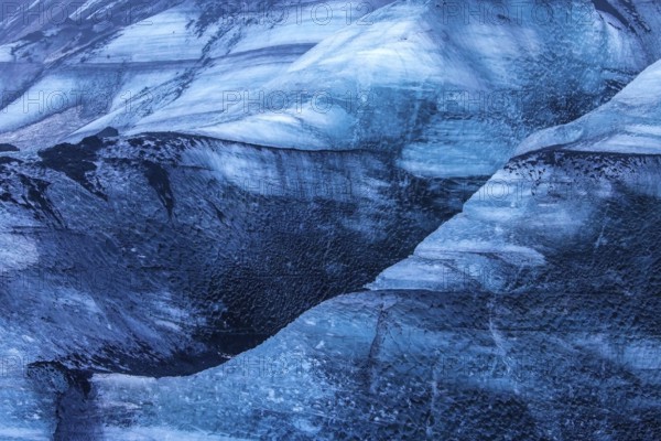 Mýrdalsjökull glacier with layers of black volcanic ash, ice cap on the top of the active Katla volcano in the south of Iceland near Vík í Mýrdal