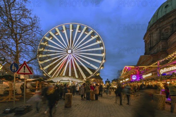 Ferris wheel at the winter village, Christmas market at dusk, St Elisabeth's Church on the right, Jakobsplatz, Nuremberg, Middle Franconia, Bavaria, Germany, Europe