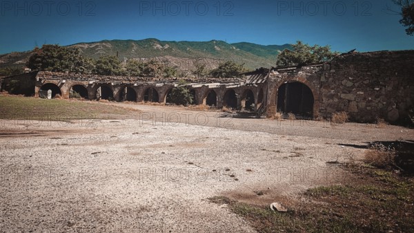Historical ruins surrounded by nature near mountains in daylight, Georgia, Tbilisi, Asia