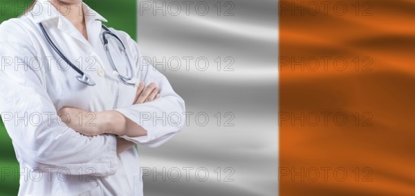 Doctor with crossed arms on Ireland flag. Ireland health and care concept. Female doctor on Ireland flag