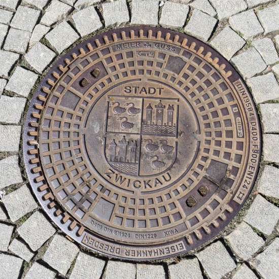 Manhole cover with coat of arms of Zwickau, Saxony, Germany, Europe
