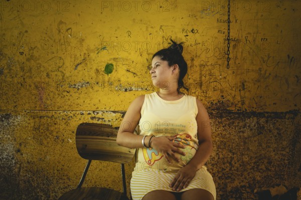 Rosalba, 18 years old, was recruited into prostitution at 14, last year she became pregnant, she is 8 months pregnant. She is currently living back in her family's hut in Túrgua, Venezuela, South America