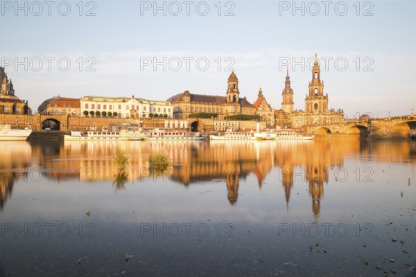Silhouette of the Old Town with reflection in the Elbe in the morning, steamboats on the Terrassenufer, Brühl's Terrace, Sekundogenitur, Ständehaus, Georgentor, Hausmannsturm, Hofkirche and Augustusbrücke, Dresden, Saxony, Germany, Europe
