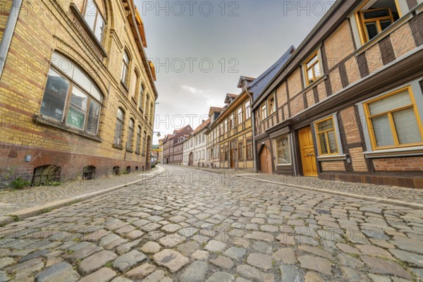 Historic town street with half-timbered houses and a narrow cobbled street, Harz Mountains, Germany, Europe