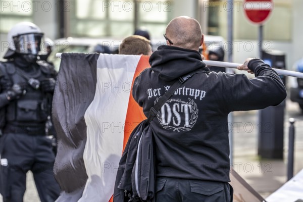 The neo-Nazi group Jung und Stark, JS, demonstrates in the city centre of Essen, demanding the remigration of foreigners, chanting Deutschland den Deutschen Ausländer raus, approx. 150 ultra right-wingers, dressed in black and wearing typical scene clothing, several groups demonstrate against the Nazi march, Essen, North Rhine-Westphalia, Germany, Europe