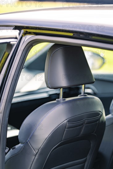 Detailed view of the rear vehicle interior with a leather seat and headrest, e-car sharing, Deer Mobility, MG4, Calw, Germany, Europe