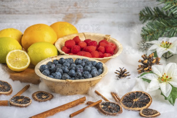 Healthy fruit and berries, white background, Christmassy decoration