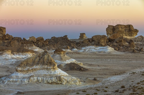 Eroded rock formations on a fossilised reef edge, at blue hour, Huqf stone desert, Arabian Peninsula, Sultanate of Oman