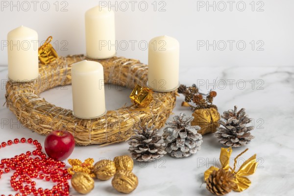 Making an Advent wreath, white candles, Christmas decorations, white background