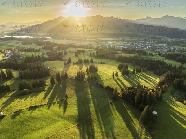 Mountain range near village Wertach, view to lake Gruentensee and village Wertach, sunrise, autumn colors, aerial view, Allgaeu, Bavaria, Germany, Europe