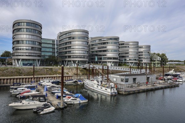 Duisburg, Ruhr area, North Rhine-Westphalia, Germany, Duisburg inner harbour. Marina Duisburg, the marina in the inner harbour in front of the Five Boats office building with the WDR regional studio Duisburg, Europe