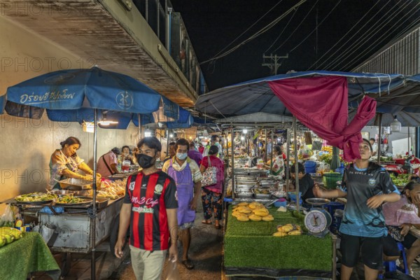 Food stalls with street food at the night market in Trat, Thailand, Asia